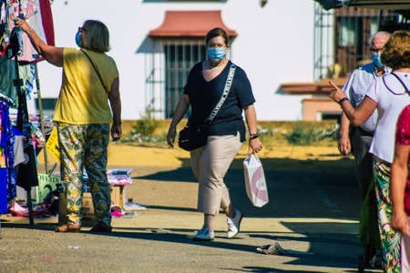 Carmona Spain July 19, 2021 Unidentified Spanish people with face mask shopping at local market in downtown during Coronavirus outbreak hitting Spain, wearing a mask is mandatoryのeditorial素材