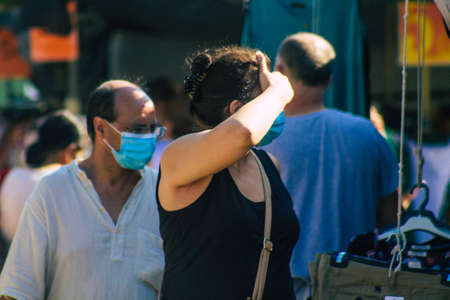 Carmona Spain July 19, 2021 Unidentified Spanish people with face mask shopping at local market in downtown during Coronavirus outbreak hitting Spain, wearing a mask is mandatoryのeditorial素材