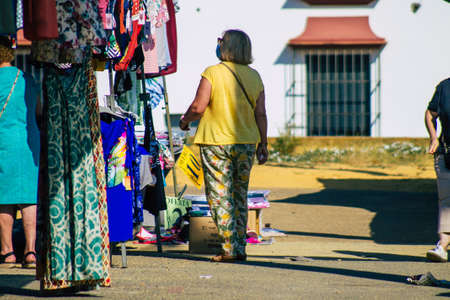 Carmona Spain July 19, 2021 Unidentified Spanish people with face mask shopping at local market in downtown during Coronavirus outbreak hitting Spain, wearing a mask is mandatoryのeditorial素材