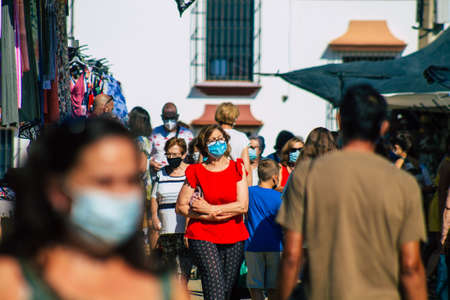 Carmona Spain July 19, 2021 Unidentified Spanish people with face mask shopping at local market in downtown during Coronavirus outbreak hitting Spain, wearing a mask is mandatoryのeditorial素材