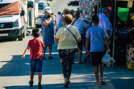 Carmona Spain July 19, 2021 Unidentified Spanish people with face mask shopping at local market in downtown during Coronavirus outbreak hitting Spain, wearing a mask is mandatoryのeditorial素材