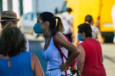 Carmona Spain July 19, 2021 Unidentified Spanish people with face mask shopping at local market in downtown during Coronavirus outbreak hitting Spain, wearing a mask is mandatoryのeditorial素材