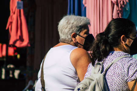 Carmona Spain July 19, 2021 Unidentified Spanish people with face mask shopping at local market in downtown during Coronavirus outbreak hitting Spain, wearing a mask is mandatoryのeditorial素材