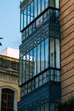 Seville Spain July 21, 2021 Facade of a building in the streets of Seville, an emblematic city and the capital of the region of Andalusia, in the south of Spainのeditorial素材