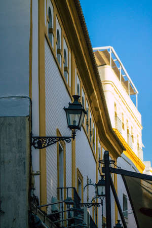 Seville Spain July 21, 2021 Facade of a building in the streets of Seville, an emblematic city and the capital of the region of Andalusia, in the south of Spainのeditorial素材