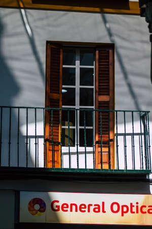 Seville Spain July 21, 2021 Facade of a building in the streets of Seville, an emblematic city and the capital of the region of Andalusia, in the south of Spainのeditorial素材