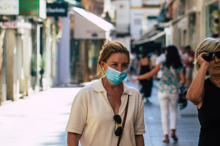 Seville Spain July 21, 2021 Pedestrians shopping in the main commercial street of during coronavirus outbreak hitting Spain, wearing a mask in the street is not mandatory but most of people wear itのeditorial素材