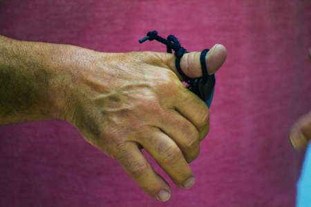 Seville Spain July 23, 2021 Closeup of the hands of castanets players, favorite musical instrument of flamenco dancers in Spain, gives rhythm and accompanies singingの写真素材