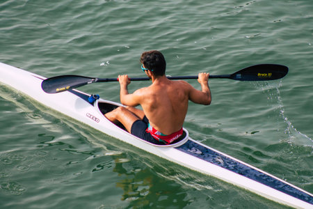 Seville Spain July 23, 2021 Unidentified people rowing on the Guadalquivir river that crosses...