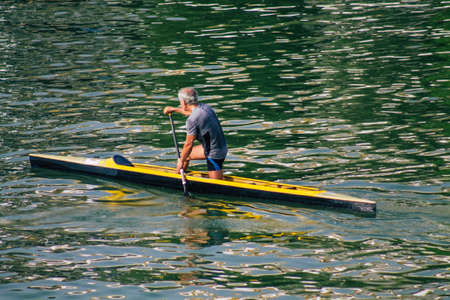 Seville Spain July 23, 2021 Unidentified people rowing on the Guadalquivir river that crosses Seville during the coronavirus pandemic affecting Spainのeditorial素材