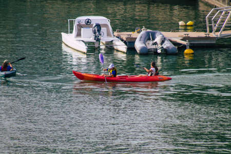 Seville Spain July 23, 2021 Unidentified people rowing on the Guadalquivir river that crosses Seville during the coronavirus pandemic affecting Spainのeditorial素材