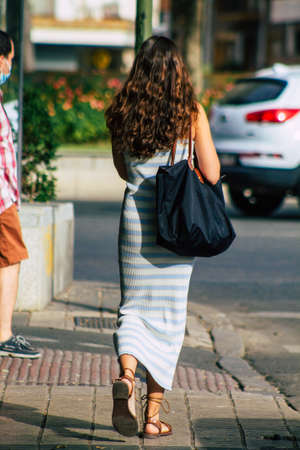 Seville Spain July 23, 2021 Pedestrians walking in the street of Seville during coronavirus outbreak hitting Spain, wearing a mask in the street is not mandatory but most of people wear itのeditorial素材