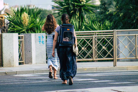 Seville Spain July 23, 2021 Pedestrians walking in the street of Seville during coronavirus outbreak...
