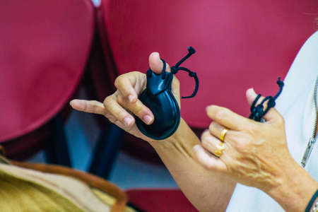 Seville Spain July 23, 2021 Closeup of the hands of castanets players, favorite musical instrument of flamenco dancers in Spain, gives rhythm and accompanies singingのeditorial素材
