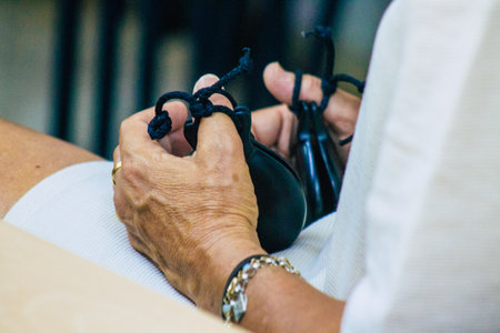Seville Spain July 23, 2021 Closeup of the hands of castanets players, favorite musical instrument of flamenco dancers in Spain, gives rhythm and accompanies singingのeditorial素材