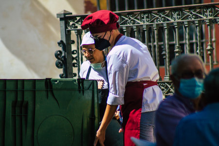 Carmona Spain July 24, 2021 Bar staff taking out the trash at the end of the service