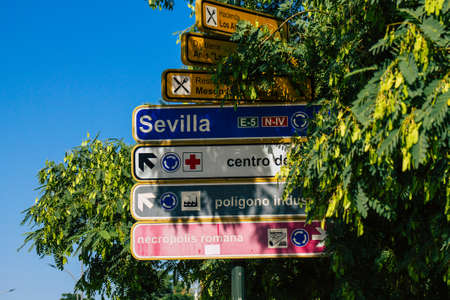 Carmona Spain July 26, 2021 Road sign, erected at the side of or above roads to provide information to road user in the typical narrow and meandering town of Carmona called The Bright Star of Europeの写真素材