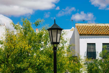 Carmona Spain July 26, 2021 Street lamp in the narrow streets in the town of Carmona called The Bright Star of Europe, the town shows a typical narrow and meandering Arabic layoutの写真素材
