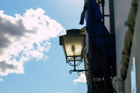 Carmona Spain July 26, 2021 Street lamp in the narrow streets in the town of Carmona called The...