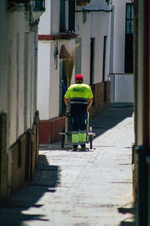 Carmona Spain July 30, 2021 Street cleaner working in Carmona called The Bright Star of Europe, the town shows a typical narrow and meandering Arabic layoutの写真素材