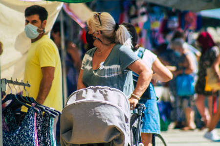 Carmona Spain July 26, 2021 Unidentified Spanish people with face mask shopping at local market in downtown during Coronavirus outbreak hitting Spain, wearing a mask is mandatoryのeditorial素材