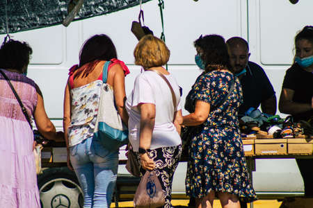 Carmona Spain July 26, 2021 Unidentified Spanish people with face mask shopping at local market in downtown during Coronavirus outbreak hitting Spain, wearing a mask is mandatoryのeditorial素材