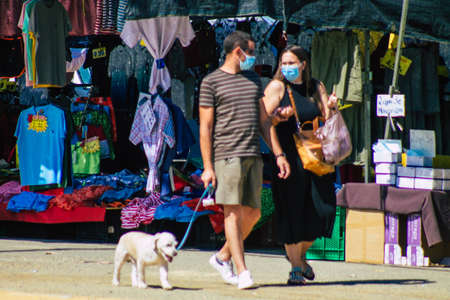 Carmona Spain July 26, 2021 Unidentified Spanish people with face mask shopping at local market in downtown during Coronavirus outbreak hitting Spain, wearing a mask is mandatoryのeditorial素材