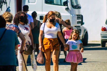 Carmona Spain July 26, 2021 Unidentified Spanish people with face mask shopping at local market in downtown during Coronavirus outbreak hitting Spain, wearing a mask is mandatoryのeditorial素材