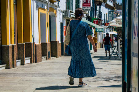 Carmona Spain July 30, 2021 Pedestrian walking in the streets of Carmona during the coronavirus outbreak hitting Spain, wearing a mask is not mandatory but most of people wear itのeditorial素材