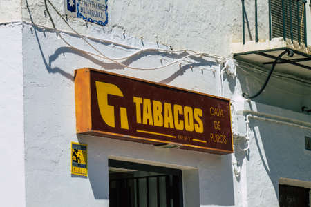 Carmona Spain July 26, 2021 Commercial sign front a business located in Carmona, a old city called The Bright Star of Europe, the town shows a typical narrow and meandering Arabic layoutのeditorial素材