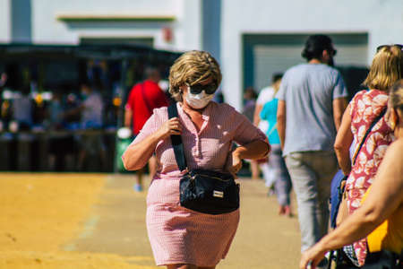 Carmona Spain July 26, 2021 Unidentified Spanish people with face mask shopping at local market in downtown during Coronavirus outbreak hitting Spain, wearing a mask is mandatoryのeditorial素材