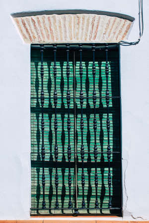 Carmona Spain July 31, 2021 Closeup of window of a old house in the narrow streets in town of Carmona, the town shows a typical narrow and meandering Arabic layoutの写真素材