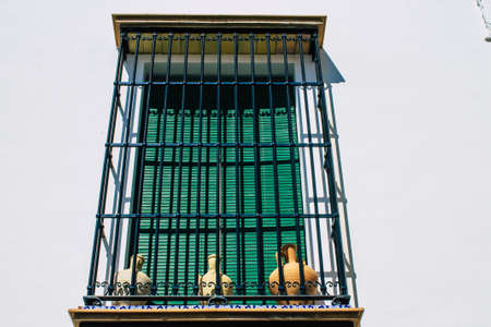 Carmona Spain July 31, 2021 Closeup of window of a old house in the narrow streets in town of...