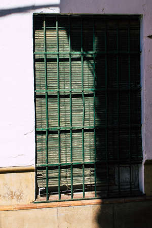 Carmona Spain July 31, 2021 Closeup of window of a old house in the narrow streets in town of...
