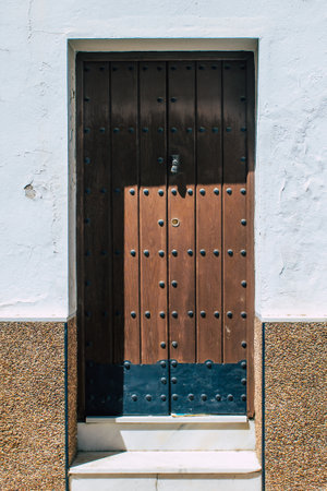 Closeup of a door of old house in the narrow streets in town of Carmona called The Bright Star of...