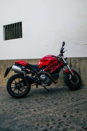 Carmona Spain July 30, 2021 Ducati Monster motorcycle parked in the streets of Carmona, the town shows a typical narrow and meandering Arabic layoutのeditorial素材