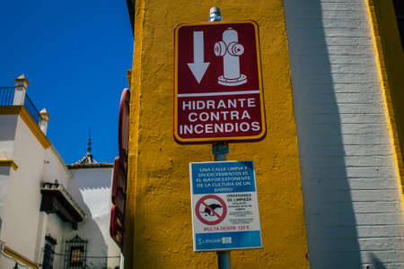 Seville Spain August 11, 2021 Street sign or road sign, erected at the side of or above roads to provide information to road user in the downtown area of Sevilleの写真素材