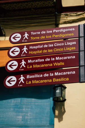Seville Spain August 11, 2021 Street sign or road sign, erected at the side of or above roads to provide information to road user in the downtown area of Sevilleの写真素材