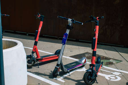Seville Spain August 11, 2021 Electric scooter to rent parked in the streets of Seville, operating...