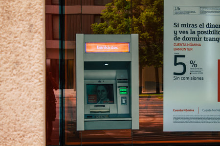 Seville Spain August 17, 2021 ATM located in the streets of Seville, an emblematic city and the capital of the region of Andalusia, in the south of Spainのeditorial素材