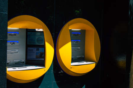 Seville Spain August 21, 2021 ATM located in the streets of Seville, an emblematic city and the capital of the region of Andalusia, in the south of Spainの写真素材