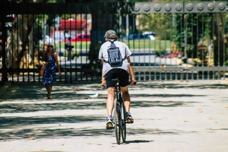 Seville Spain August 28, 2021 People rolling with bicycle in the streets of Seville, an emblematic...