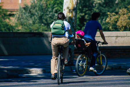 Seville Spain August 28, 2021 People rolling with bicycle in the streets of Seville, an emblematic...