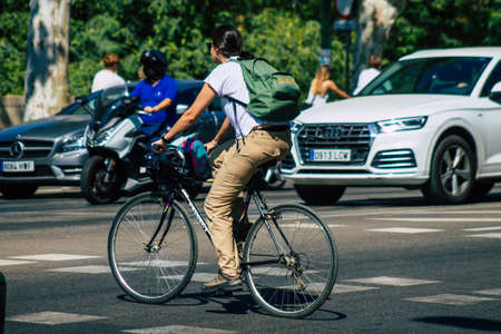 Seville Spain August 28, 2021 People rolling with bicycle in the streets of Seville, an emblematic...