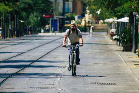 Seville Spain August 28, 2021 People rolling with bicycle in the streets of Seville, an emblematic...
