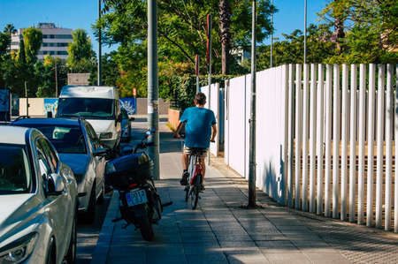 Seville Spain September 04, 2021 People rolling with a bicycle in the streets of Seville, an...