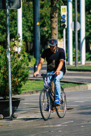 Seville Spain September 04, 2021 People rolling with a bicycle in the streets of Seville, an emblematic city and the capital of the region of Andalusia, in the south of Spainの写真素材