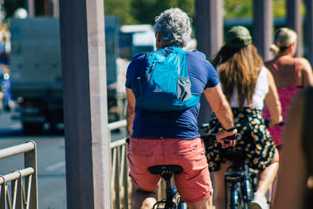 Seville Spain September 04, 2021 People rolling with a bicycle in the streets of Seville, an emblematic city and the capital of the region of Andalusia, in the south of Spainの写真素材