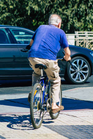 Seville Spain September 04, 2021 People rolling with a bicycle in the streets of Seville, an emblematic city and the capital of the region of Andalusia, in the south of Spainの写真素材