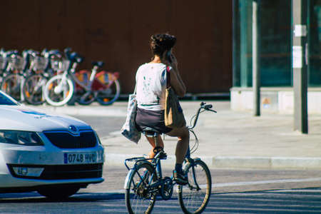 Seville Spain September 04, 2021 People rolling with a bicycle in the streets of Seville, an emblematic city and the capital of the region of Andalusia, in the south of Spainの写真素材